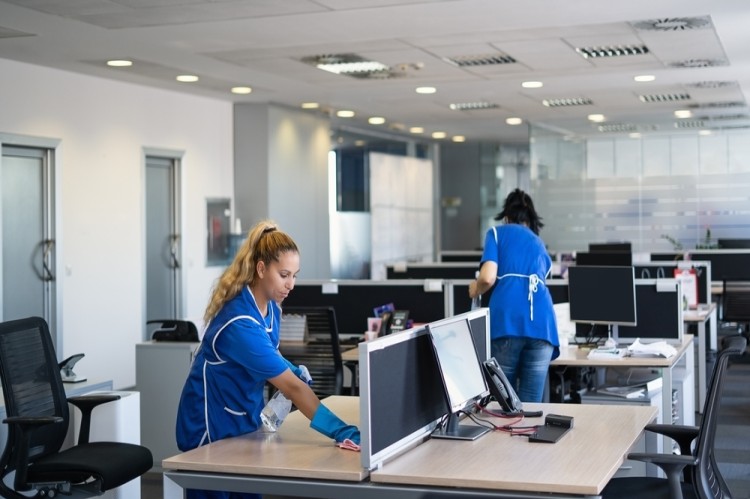 Professional office cleaners cleaning office