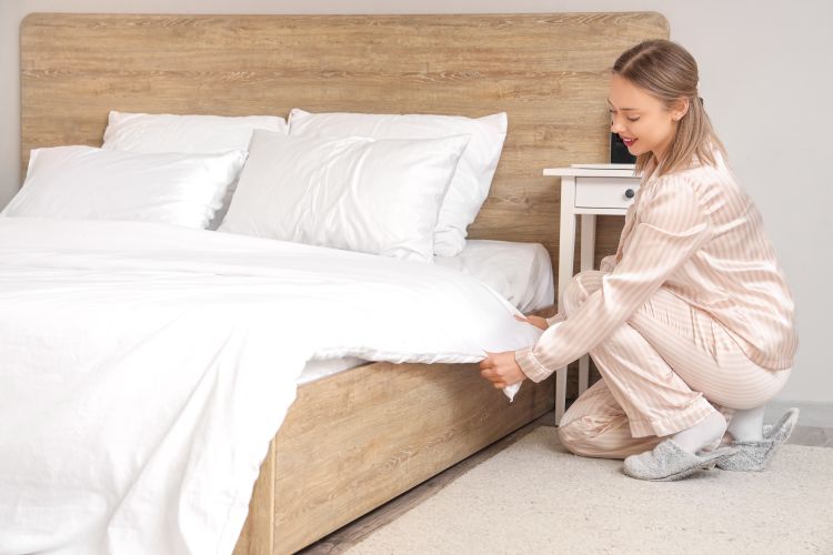 Woman cleaning her bedroom