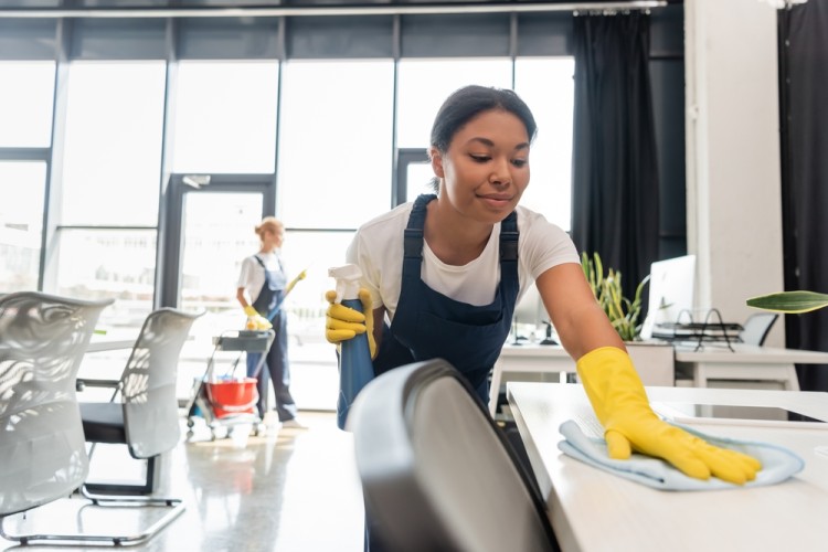 Professional cleaner cleaing an office